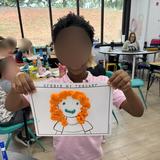 The Haven Academy (formerly Canton Homeschool Resources LLC) Photo #6 - A student shows off a "Create My Teacher" art project