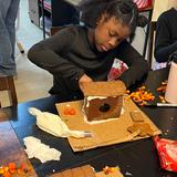 Hill Country Arts Academy Photo #12 - Celebrating the holiday by learning to construct gingerbread houses. Students are utilizing math and science skills while exploring their creativity.