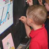 Calvary Christian Academy & Preschool Photo #5 - Writing on the chalkboard