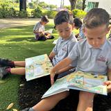 Conchita Espinosa Academy Photo #2 - First grade partner reading