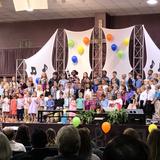 Harvest Community School Photo - Lower School performing at our October Community Fellowship