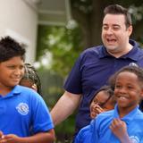 Lake Rose Christian Academy Photo #12 - Lake Rose Christian Academy Administrator Brandon Jones shares a joyful moment with students on campus, engaging with them in a relaxed, encouraging setting.