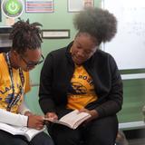 Lake Rose Christian Academy Photo #10 - Lake Rose Christian Academy students collaborate during a classroom activity, working together as they read and discuss their material.