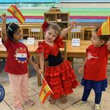 Montessori Children's Academy Photo #4 - Children at Montessori Children's Academy celebrate cultural diversity with joy and pride, dressed in vibrant attire and holding flags from Spain. This lively classroom moment reflects the school's commitment to global awareness, respect, and unity-where every child learns to appreciate the beauty of different cultures.