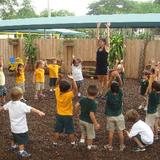 Montessori Children's House Photo #2 - Our fitness instructor teaching a class on the MCH playground.