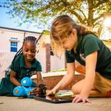 Pine Crest School Photo #10 - Lower School students learning to use the Dash Coding Robot in an outdoor setting.