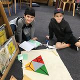 Safety Harbor Montessori Academy Photo #6 - Elementary students using the Constructive Triangles materials to learn about polygons.