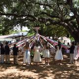 St. Stephen's Episcopal Day School Photo #6 - The Maypole has become a favorite part of the graduation festivities. A tall pole with long pastel-colored ribbons suspended from the top, festooned with flowers to match the flowers worn by the graduates, is erected under the oaks. Encircled by faculty, friends, and family, the graduates perform intricate dances around the Maypole.