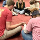 Curtis Baptist School (K3-12) Photo #3 - Upper School students praying together during Missions Week.