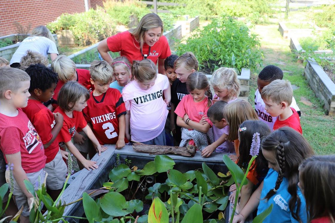First Presbyterian Day School Photo - Second grade students study frogs and toads in our educational gardens.