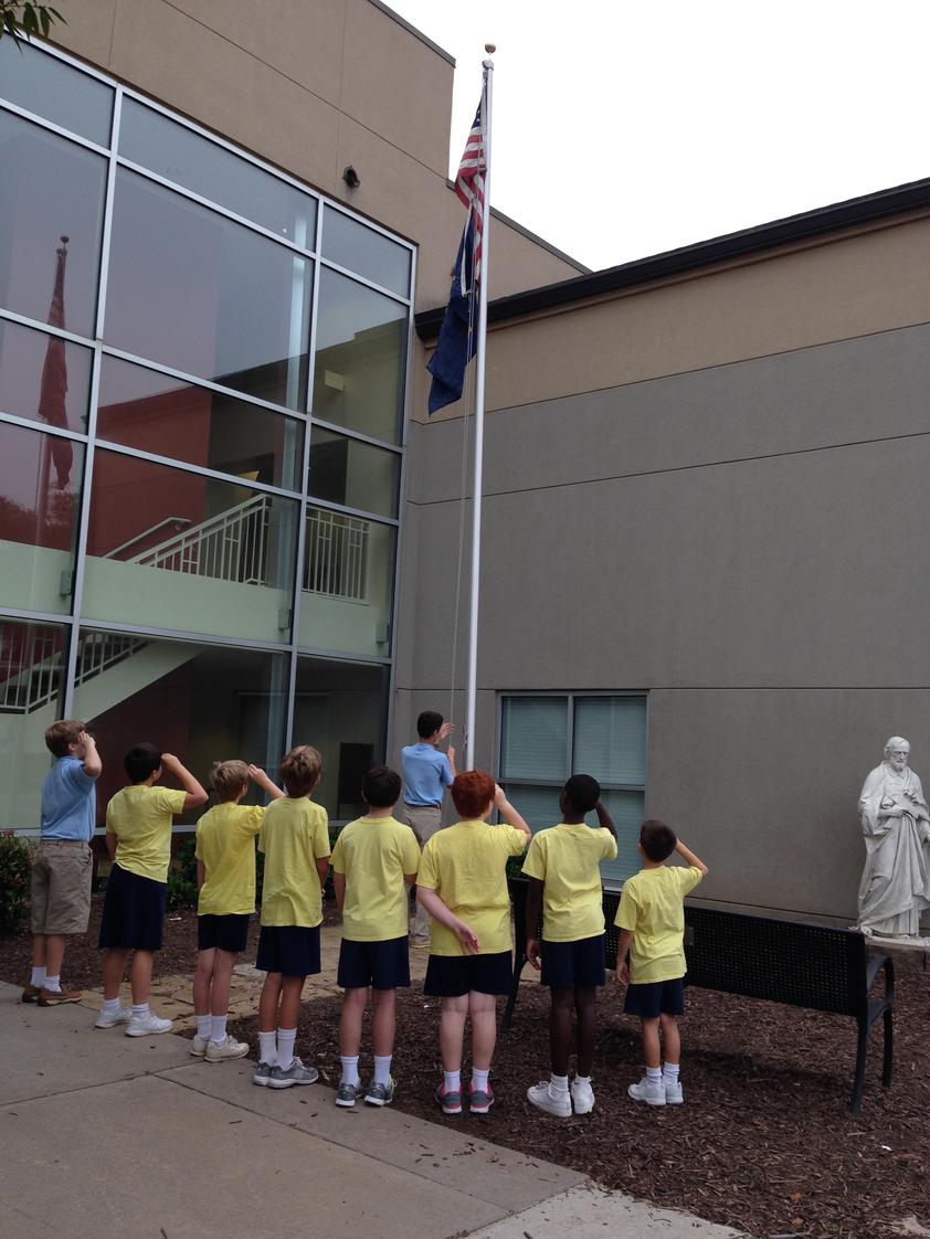 St. Joseph Catholic School Photo - The raising of the flag happens every day! Our morning announcements begin with prayer, the pledge of allegiance and St. Joseph school pledge.