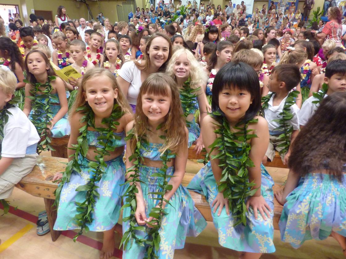 Island School Photo - May Day is Lei Day in Hawai'i. Island School celebrates with an all-school event, followed by a lu'au lunch. These first graders will perform a hula with their class. The entire student body is involved in this special day.