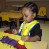 Westbrook KinderCare Photo #5 - Chandler is creating a unique painting.