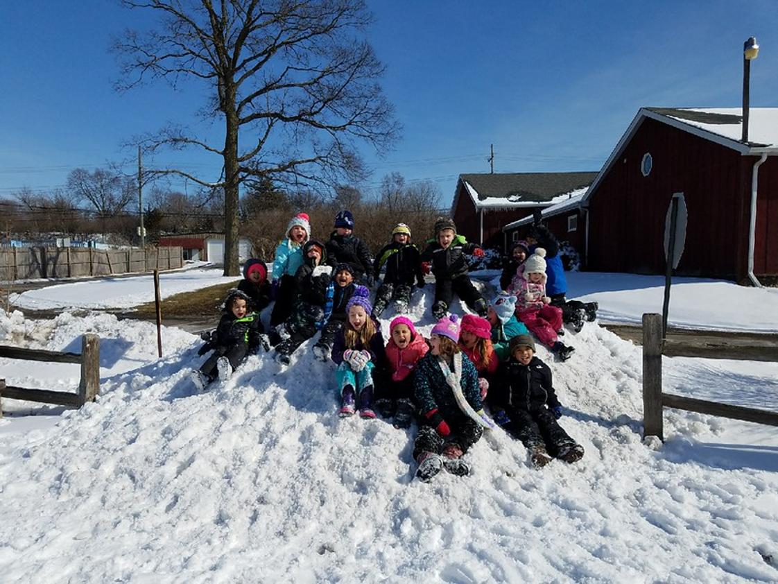 Montessori Academy Photo - Our kids spend time outside everyday, every season. Lightening and sub-zero temperatures will keep us indoors otherwise our motto is 'there's no bad weather only the wrong clothes!'