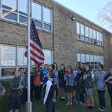 St. Catherine Of Siena Continuation School Photo #3 - Middle School students are raising the American flag to honor our country.