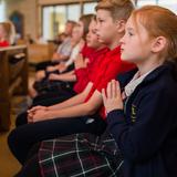 St. Theresa School Photo #8 - Weekly worship for grades 1 though 8 - Students have an opportunity to actively participate in choir, band and Gospel readings during Mass.