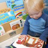 East Riverside KinderCare Photo #3 - Developing a love for literacy is a crucial step in emerging pre-reading skills.
