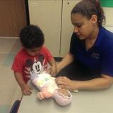 Bensenville KinderCare Photo #3 - Ms. Carmen playing with a baby with the children.