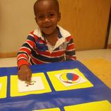 West Carol Stream KinderCare Photo #3 - Caleb is working to sort objects into different categories.